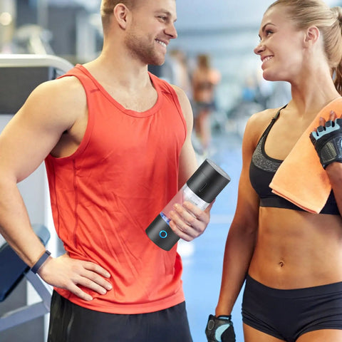 Man holding Hydrogen Water Bottle Generator With SPE Technology On The Go Portable 230 Milliliter Capacity in gym