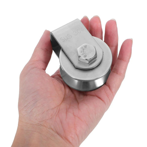 Heavy Duty Stainless Steel Pulley Wheel Track Roller For Sliding Doors And Gates Built Different With Zero Noise Vibes Smooth Glide Performance Handles Heavy Loads On Wire Rope Systems Top Tier, held in hand.