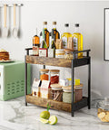 Two Tier Countertop Coffee Station Organizer Rack with condiments and oils on kitchen counter, wooden shelves, brown.