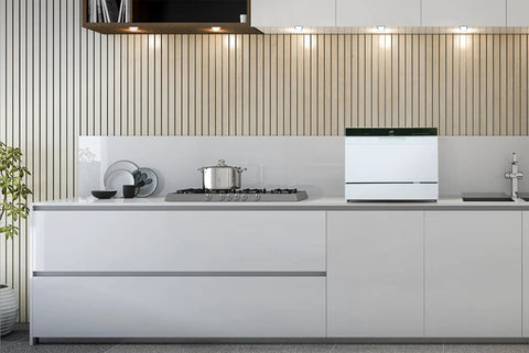 Hassle Free Countertop Dishwasher With Stainless Steel Tub And Delay Start For Small Apartments And Condos on a sleek kitchen counter.