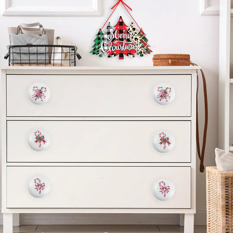 Festive Peppermint Ceramic Knob Covers For Cabinets And Drawers Super Easy Install Holiday, white knobs on a dresser with decorations.
