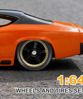 Close-up of an orange diecast car featuring 1/64 scale black 10-spoke gold line rims from Four Pack 1/64 Scale Wheels And Tires Set With Real Riders Rims Axles Included For RC Diecast Cars And DIY Models 10 Spoke Gold Line Black Rims For Custom Builds And Upgrades.