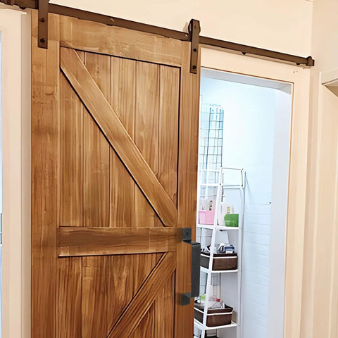 Dope Black Barn Door Handle Set For Sliding Doors And More installed on a wooden sliding door, showcasing sleek rustic steel hardware.