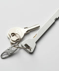 Anti Theft Zipper Clips For Backpacks And Luggage Four Pack Double Opening Carabiner Zipper Locks shown with keys attached