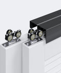 8 Ft Bypass Double Sliding Pocket Door Hardware Kit in Aluminum and Black, close-up of rollers and track. Commercial Grade.