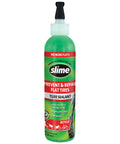Bike Tube Puncture Repair Sealant For All Bicycles Eight Ounce Bottle Non Toxic Eco Friendly Quick Seals Punctures Up To One Eighth Inch Prevents Flats And Gets You Rolling No More Flats green and red bottle with applicator tip.