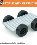 Four Piece Tech Wheels And Tires Set With 43.2x14mm Tires And 30x14mm Rims display on grey base for RC toy cars