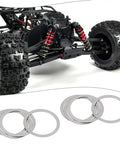 8Pcs Beefed Up Rc Differential Shim Set For Armma 6s BLX Rc Cars Outer Diameter 16Mm Inner Diameter 13Mm Thickness 0.2Mm Steel Diff Spacer Silver Compatible With Kraton Talion Notorious shown with RC car in background.