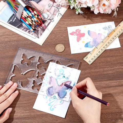 Smooth Operator Acrylic Router Template Set With Killer Butterfly Stencil For Precision Woodworking Projects shown with a hand tracing a butterfly.