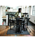 Musician playing Electronic V Drums Kit With Floating Hi Hat And Large Cymbal Pads For Realistic Drumming in a modern room
