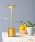 Side view of Two Pack Cordless Table Lamp Set with 5000mAh Rechargeable Battery, gold finish, on a table with fruit bowl and plant.