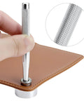 Using Heavy Duty Hole Punch Set 11 Piece Carbon Steel Punch And Rivet Tool Kit to punch leather, showing hand holding tool