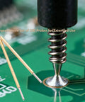 Close-up of 100 Pack 0.68mm Spring Test Probes With Round Head Pogo Pins For PCB Testing, probing a circuit board.