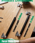 Heavy Duty Gas Struts For Trunk Hatches And Heavy Doors With Easy Mount Brackets Two Pack dimensions on wood with force indicator.