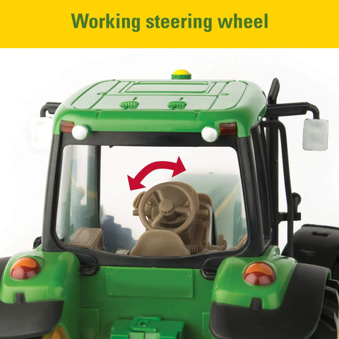 Close-up of the 1/16 Scale Farm Tractor With Wagon Toy For Kids showing functional steering wheel in green cabin.