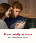Couple enjoying coffee routine next to Compact Fully Automatic Espresso And Iced Coffee Maker With One Touch Brewing.