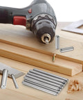 Killer Durability 200 Pieces 1 Mm By 6 Mm 304 Stainless Steel Dowel Pins on wooden surface with drill and cutting tool.