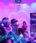 People dancing with music-themed LED glasses and colored lights in a party setting.
