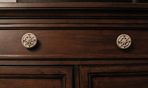 Rock Solid Compass Rose Drawer Pulls Set Of 12 In Antique White Cast Iron Nautical Cabinet Handles on wooden cabinet.