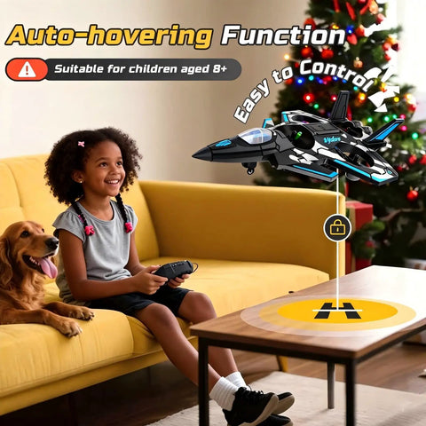 Child smiling on couch using remote for F47 RC Fighter Drone For Kids, super easy to fly with altitude hold and LED lights indoors.
