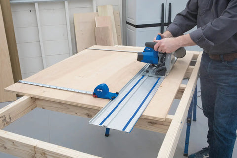 Person using Plunge Cut Track Saw With 62 Inch Guide Track And Parallel Guides 12 Amp Corded Power Pro Grade Precision For Wide Cuts In Plywood