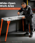 Badass Heavy Duty Portable Welding Table With Slick Swivel Wheels And Four Foldable Legs For Precision Grid Setup Knockout 1k Load Rating shown in use with worker adjusting tools.