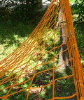 Outdoor Nylon Rope Hammock Swing With Mesh Seat in vibrant orange, strung between trees, showing durable nylon mesh with breathable design.