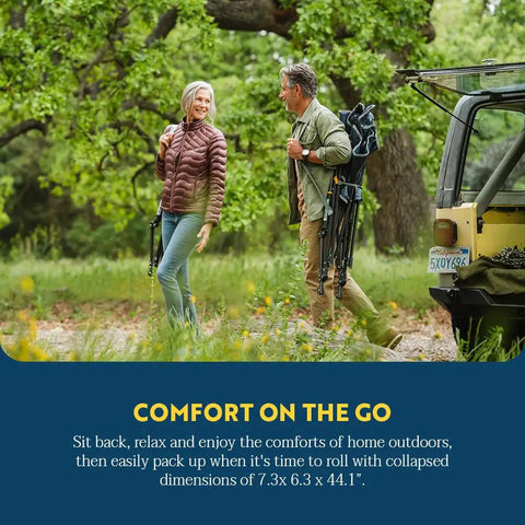 Couple carrying Comfort Pro Rocker Folding Outdoor Chair for Camping and Backyard Hangouts, collapsible and portable in indigo blue.