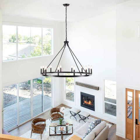 Matte Black 8 Light Farmhouse Chandelier Industrial Pendant Light Fixture hanging in a modern living room with high ceiling.