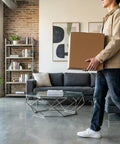 Person holding Heavy Duty Corrugated Large Mail Boxes 24x24x24 Inch Pack Of 10 Beefed Up Double Walled Shipping Boxes in living room