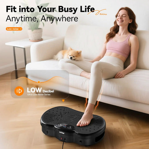 Woman using Full Body Vibration Plate Shake Platform for Home Gym Fat Burn and Toning with pet on sofa