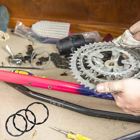 Three Size Cassette Spacer Set For Bikes 1Mm 1.5Mm 2Mm Headset And Flywheel Hub Spacers with bike gear setup in workshop