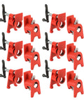 Twelve red 3/4-inch wood gluing pipe clamps with foot design and black handles