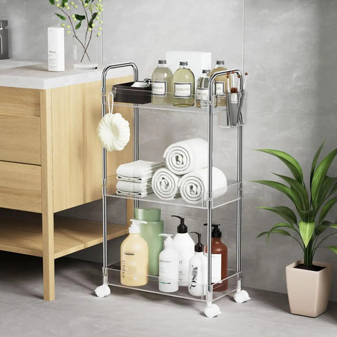 Clear 3 Tier Acrylic Rolling Storage Cart With Four Extension Poles For Tall Items And Bottles Laundry Room Bathroom Office Or Living Room Organization Mobile Multifunction Shelving Unit in bathroom setting with toiletries and towels.