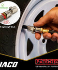 JACO FlowPro tire inflator with gauge attached to car tire valve; 100 PSI.