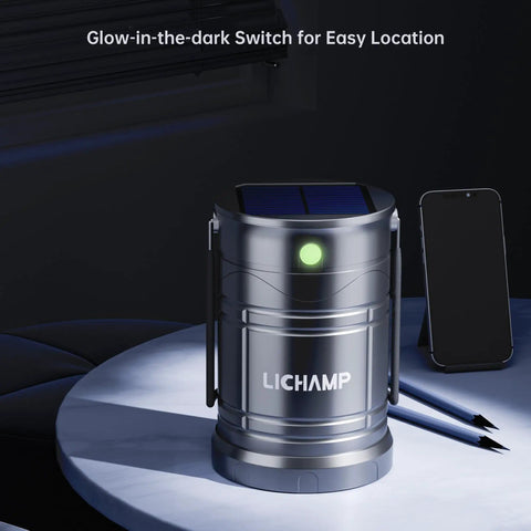 Must Have 2 Pack Solar Camping Lanterns USB Rechargeable LED Lanterns on table with glow-in-dark switch and smartphone, foldable handle