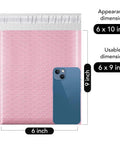Light Pink Bubble Mailers 6x10 Inches, 100 Pack Self Seal Padded Envelopes With Usable 6x9 Inner Size next to blue phone