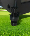 Close-up of Square Golf Launch Monitor Case leveling tool with carbon fiber reinforced shell on grass.