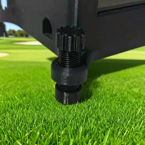 Close-up of Square Golf Launch Monitor Case leveling tool with carbon fiber reinforced shell on grass.