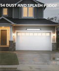 Crazy Bright 24W LED Shop Lights 5400 Lumens 6000K Daylight White mounted above garage door at night.