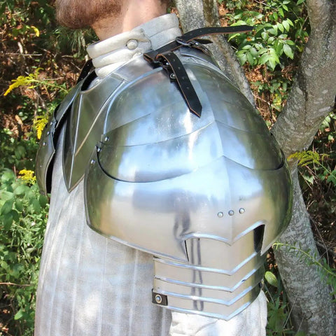 Close-up of Medieval 18 Gauge Steel Avenger Pauldrons Set With Genuine Leather Straps And Neck Harness on model's shoulder.