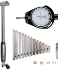Front view of dial bore gauge set with 2–6" range, 0.001" resolution; carbide anvils, 12 extension rods, adapters.
