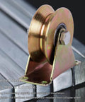 Side view of Beefed Up V Wheel Sliding Gate Track Roller With Bracket For Heavy Duty Barn Doors And Gates, on steel track.