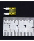 Close-up of yellow blade fuse with ruler for size, part of 60 And 120 Piece Car And Truck Blade Fuses Kit 5A 10A 15A 20A 25A 30A.