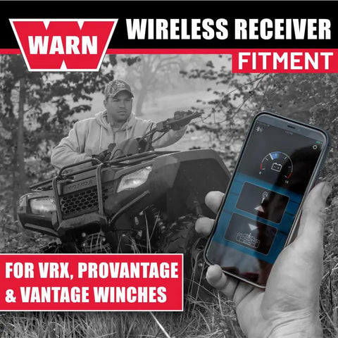Man using ATV winch with smartphone showing Hub Wireless Receiver for Powersports Winches with Bluetooth Smartphone Control