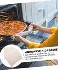 Person using 10 Pack 150x120mm Mica Plate Sheets For Microwave Heat Insulation And Fireproofing Durable Microwave Oven Accessories.