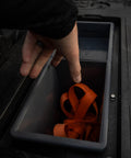 Deep Stash Bins Compatible With The New Drawer System being used to store orange gear in a truck decked drawer