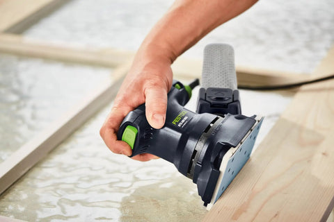 Person sanding wood with Granat P120 Grit RTS Rectangular Abrasive Sanding Sheets 80x133mm 100 Pack, using Festool sander