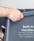 Hand gripping a built-in handle of Six Pack Dark Gray Open Front Storage Totes With Oversized Handles Built Like A Tank.