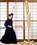 Martial artist using 43 Inch Solid Pine Kendo Tameshigiri Practice Cutting Stand Real Deal Heavy Duty Wooden Dummy Holder For Katana Training Stable Durable Platform With Varnish Finish And Safe Mat Area